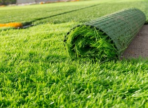 Artificial grass being laid out.