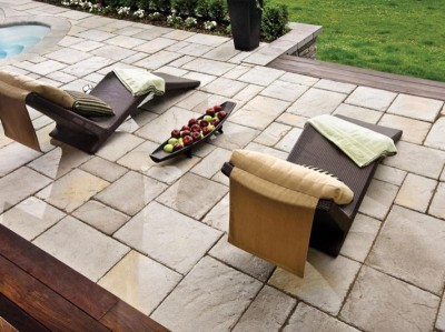 Outdoor patio stones installed with modern furniture.