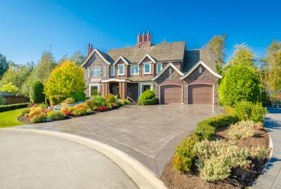 Front of large luxury house with great curb appeal.