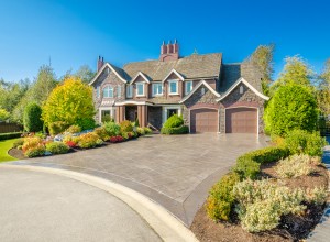 Front of large luxury house with great curb appeal.