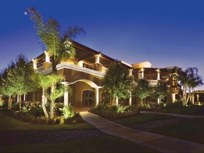 Large modern home with exterior LED landscape lighting.