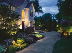 Home with outdoor lighting along a pathway.