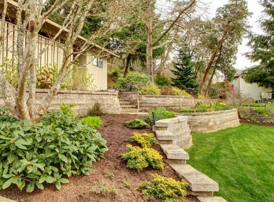 Retaining wall in a beautifully-landscaped backyard space. Retaining wall in a beautifully-landscaped backyard space.