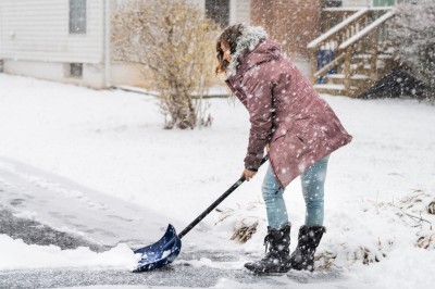 Woman shoveling snow. Woman shoveling snow.